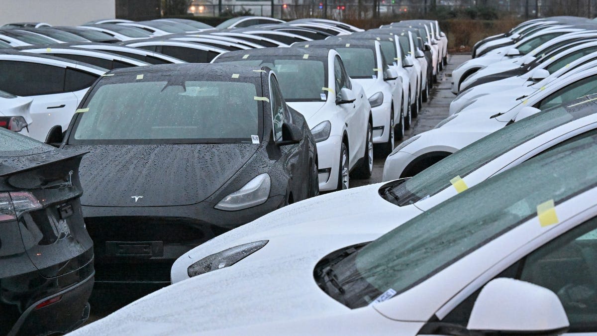You can see the unsold Teslas piling up in parking lots — from space