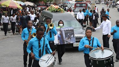 Hundreds mourn gang killings of a Haitian mission director and a young American couple