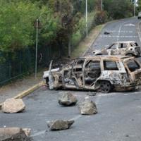 Burnt vehicles in the Magenta district of Noumea in France's Pacific territory of New Caledonia, on May 21, 2024