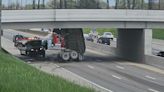 Video shows moment truck hauling gravel slams into overpass on I-94 in Detroit