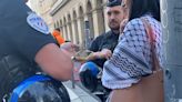 Video: Woman detained by French police over Palestinian scarf