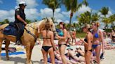 How police officers on horseback patrol South Florida. Watch how they handle the crowds