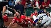 Cardinals rally in the eighth and then hold off Cubs for a victory