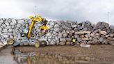 Autonomous excavator creates 3D map of rocks to build 19-foot-tall wall