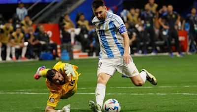 Messi and Argentina overcome Canada and poor surface, start Copa America title defense with 2-0 win