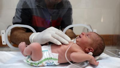 Newborn saved from dead mother's womb as Israeli strikes kill dozens across Gaza