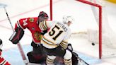 Poitras and Frederic help undefeated Boston Bruins blank Chicago Blackhawks 3-0