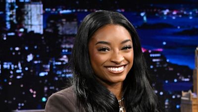 Simone Biles poses in stunning little black dress while looking back on time with husband Jonathan Owen