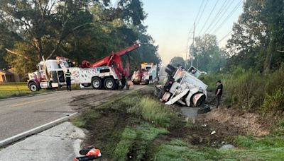 Overturned trailer temporarily blocks Juban Road at Wax Road