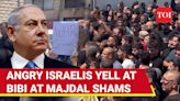 'War Criminal': Israelis Jeer Netanyahu, Protest As He Visits Golan Heights Missile Attack Site | International - Times of India...