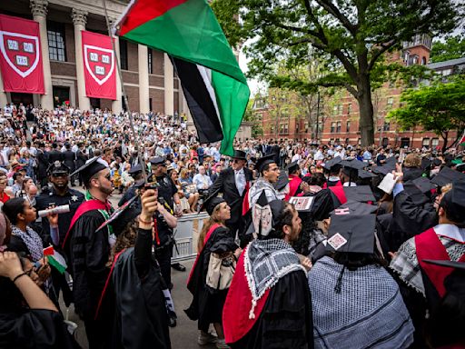 Students walk out of Harvard College graduation; UCLA contends with new protest