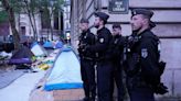 As Olympics near, Paris police clear 100 migrants from camp near City Hall