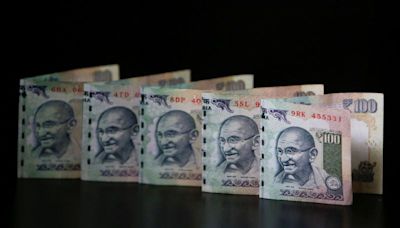 Overvalued Indian rupee slips to record low, tracking Chinese yuan declines