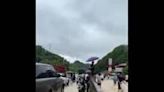 China: People Enjoy Fishing On Flooded Road In Nanning, Guangxi