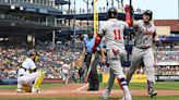 Adam Duvall of the Atlanta Braves high-fives with Orlando Arcia after hitting a solo home run in the eighth inning against the Pittsburgh Pirates...