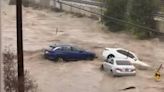 Raging waters sweep away vehicles and flood homes in San Diego. See the devastation