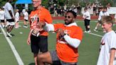 Myles Garrett active at youth camp while wearing sleeve after minicamp hamstring tweak
