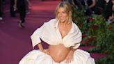 Sienna Miller bares baby bump at celebrity and royal-studded Vogue event