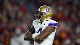 Washington's Zion Tupuola-Fetui has emotional moment talking about his dad after USC win