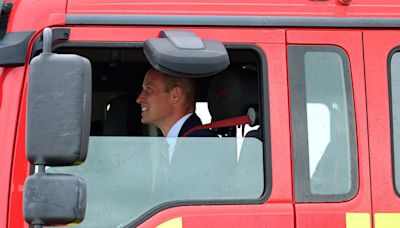 Prince of Wales mans fire engine to put out blaze at his old RAF base