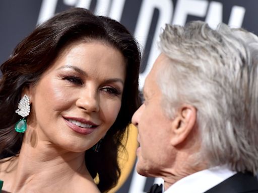 Catherine Zeta-Jones and husband Michael Douglas look so loved-up during star-studded outing