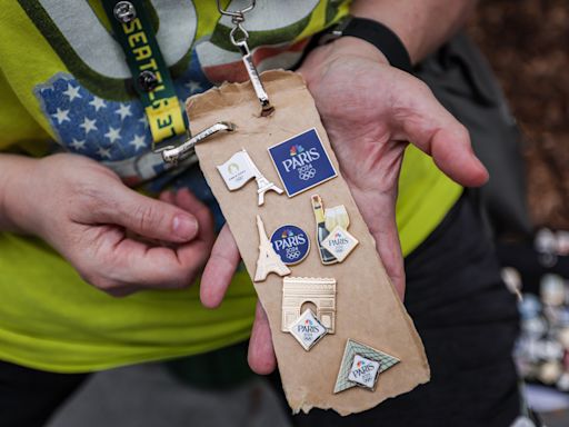 Olympic pin trading fever sweeps social media. What is the tradition and who is taking part?