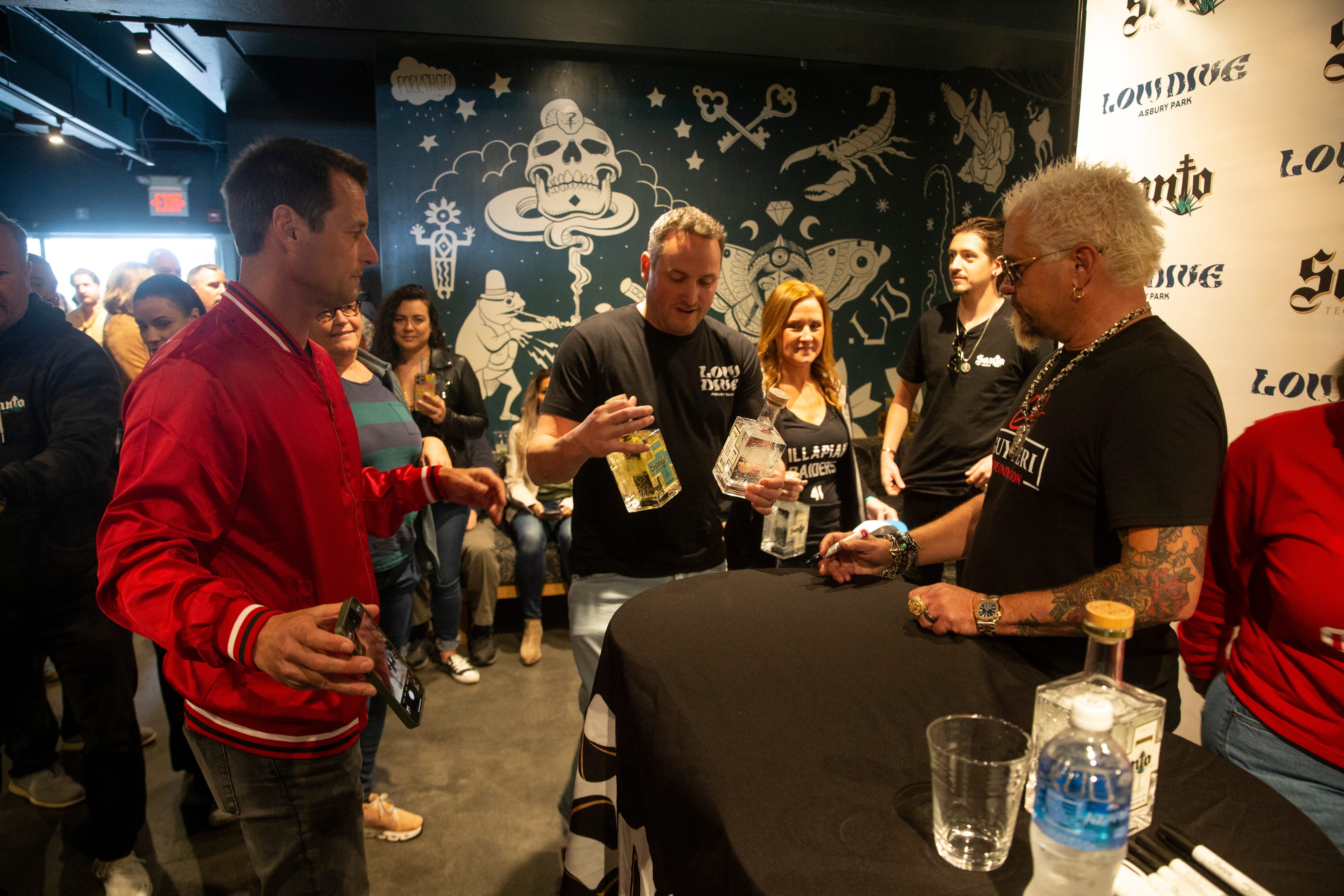 Food Network star Guy Fieri visits Asbury Park boardwalk to promote Santo Spirits