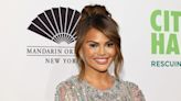 Chrissy Teigen shows her natural hair length with a relatable mini bob ponytail