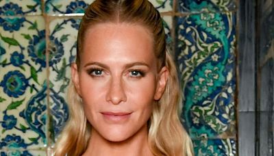 Poppy Delevingne wows in a plunging gold glitter dress