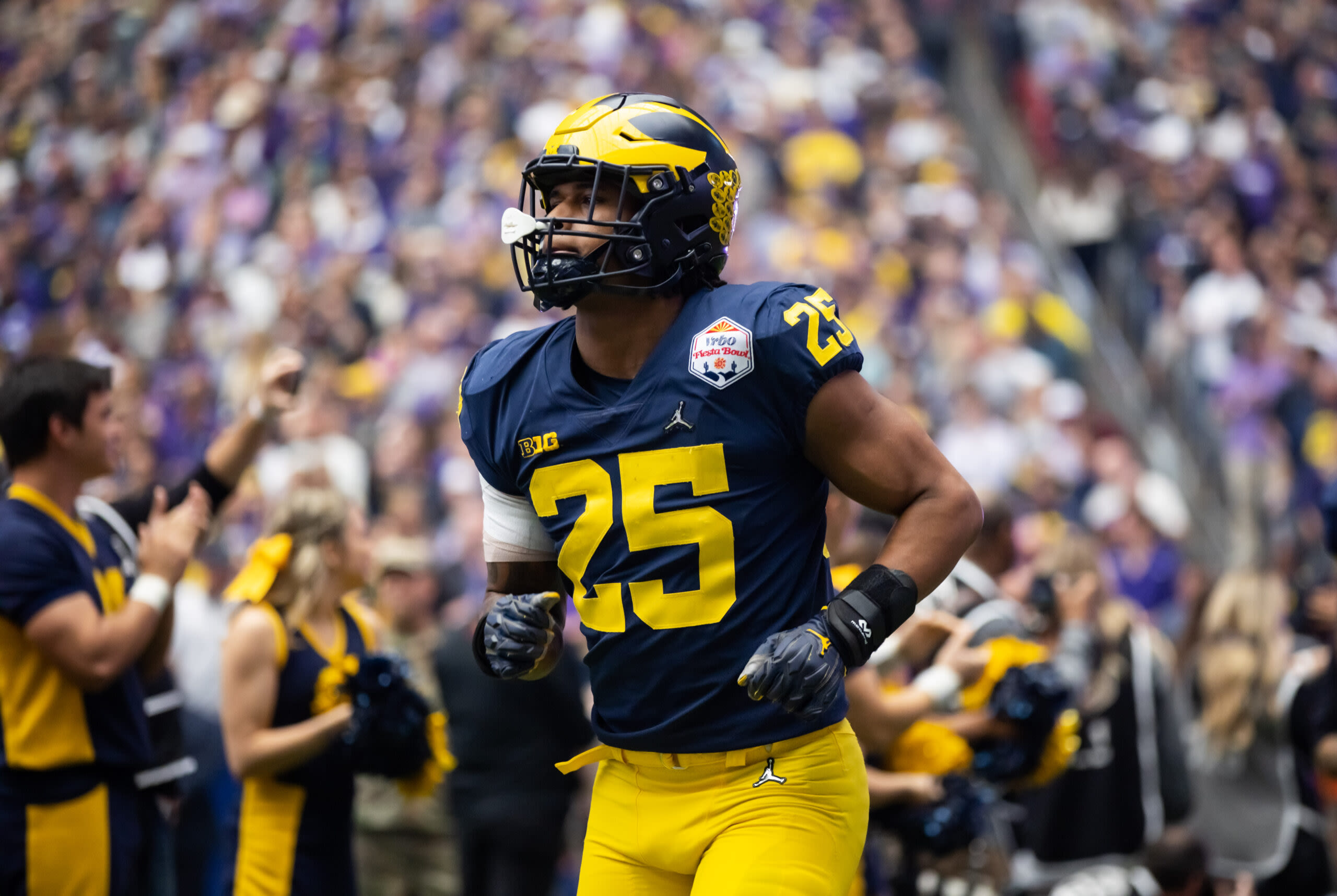 Jim Harbaugh praises Junior Colson: ‘He’s making all of the calls’