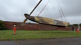 Huge RAF plane lifted from fort by crane