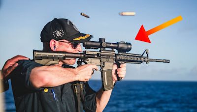 US Navy Mocked for Photo of Commander Shooting Rifle with Scope Backwards