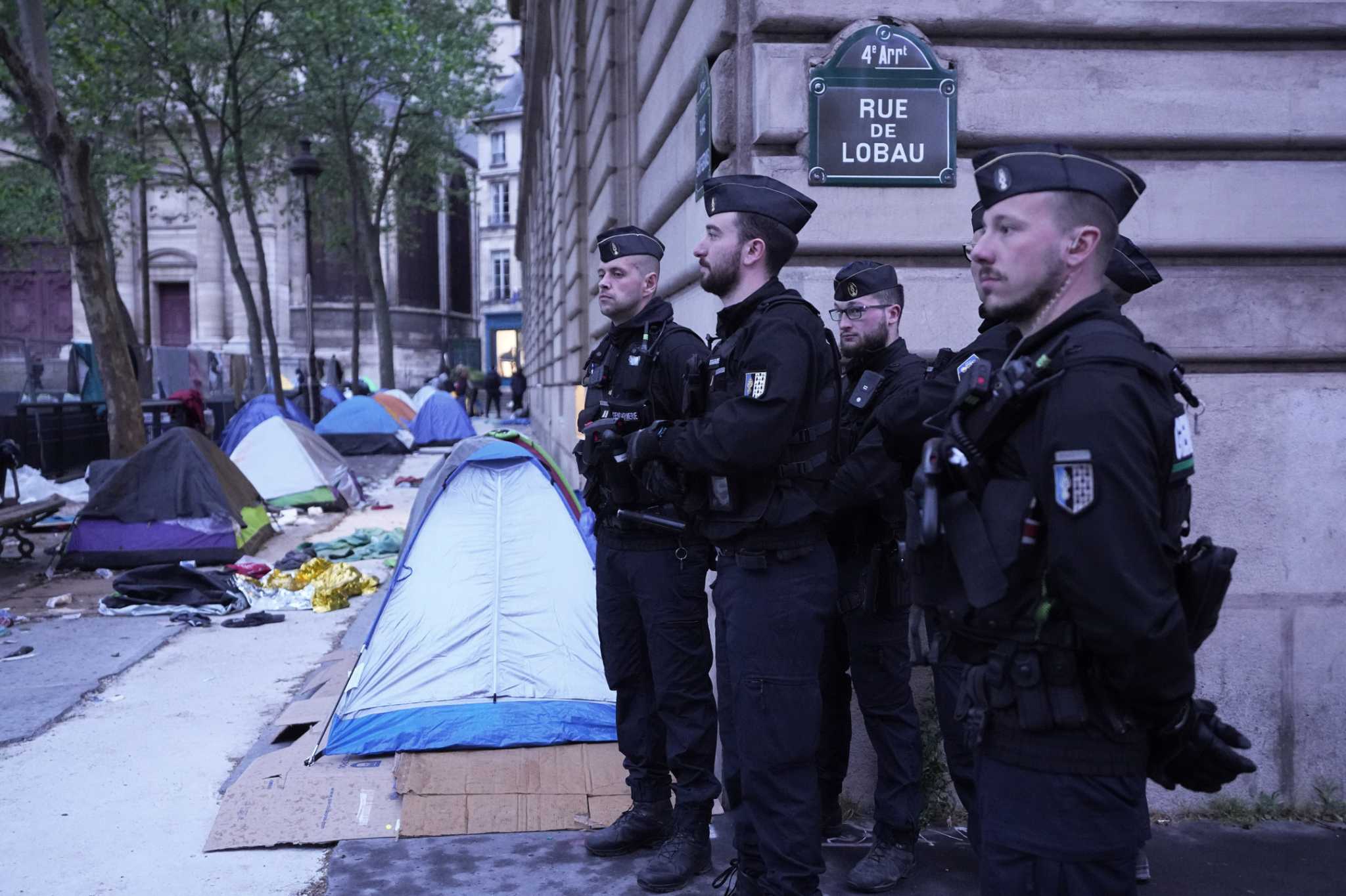 Ahead of the Paris Olympics, police clear a migrant camp near City Hall