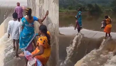 Saree-Clad Pregnant Woman Crossing 'Dangerous Stream' Will Make Your Heart Skip a Beat | VIDEO