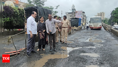 NHA officials assured to fill potholes on Shahad bridge after motorists complained | Mumbai News - Times of India