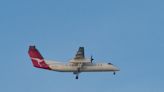 QantasLink Q300 crew unaware of Cherokee taking off on cross runway