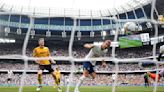 Soccer-Arsenal maintain perfect start, Kane sets record in Spurs win