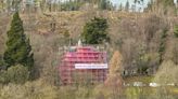 Castle swathed in seven-storeys of pink mesh for conservation work