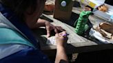 Homeless find human bond playing bingo in the park with Fort Worth TCU students