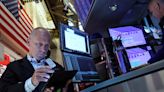 Wall St closes higher as investors return to megacap stocks