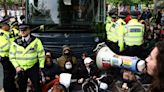 Protesters try to stop UK migrant removals from temporary accommodation