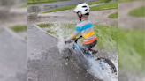 Four-Year-Old Mountain Bike Sensation Enjoys Waist Deep Puddles