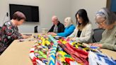 Seniors College origami class sends hope — and 1,000 paper cranes — to Ukrainian embassy
