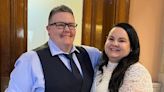 Cupid on the clock with four couples exchanging Valentine's wedding vows at City Hall