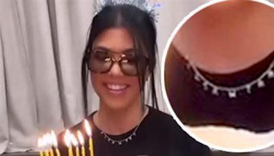 Kourtney Kardashian wears a necklace with the first letter of the names of all the kids in her life as she celebrates her 45th birthday at IHOP