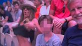 Olympics fans stunned as woman flashes her BOOBS while alongside child