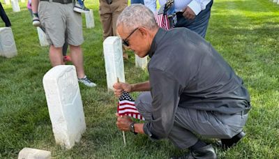 Former President Barack Obama makes surprise appearance at Alexandria National Cemetery