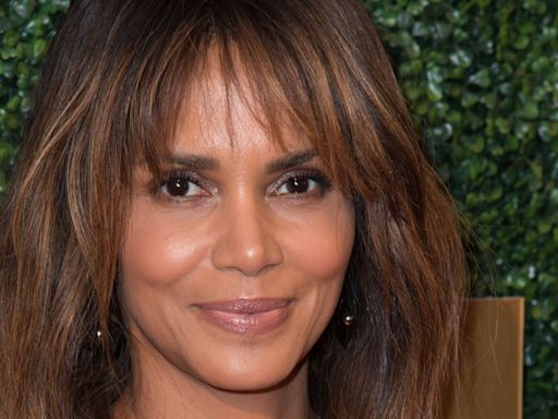 Halle Berry poses topless with cats to celebrate Catwoman anniversary