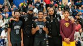 LeBron James and Carmelo Anthony pose with their sons following their high school basketball game