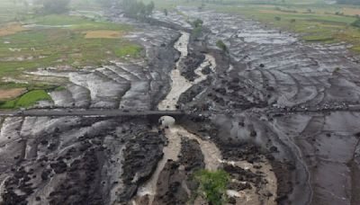 More bodies found in Indonesia after flash floods killed dozens and submerged homes